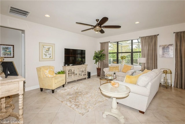 living area with light tile patterned floors, ceiling fan, recessed lighting, visible vents, and baseboards