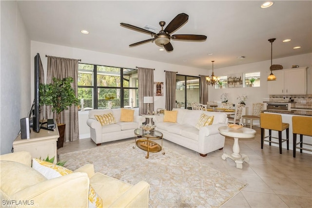 living room featuring recessed lighting, plenty of natural light, and light tile patterned floors