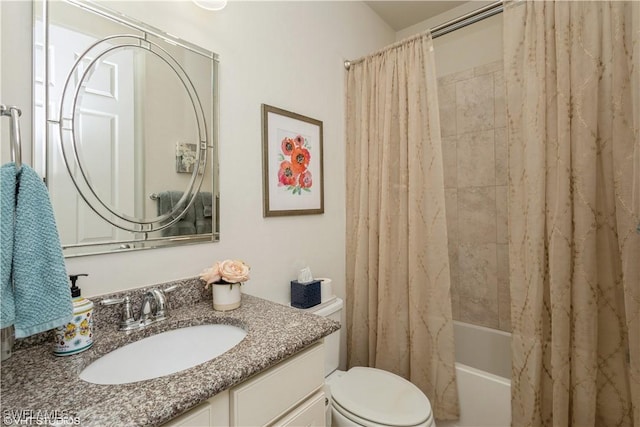 full bathroom featuring toilet, shower / bathtub combination with curtain, and vanity