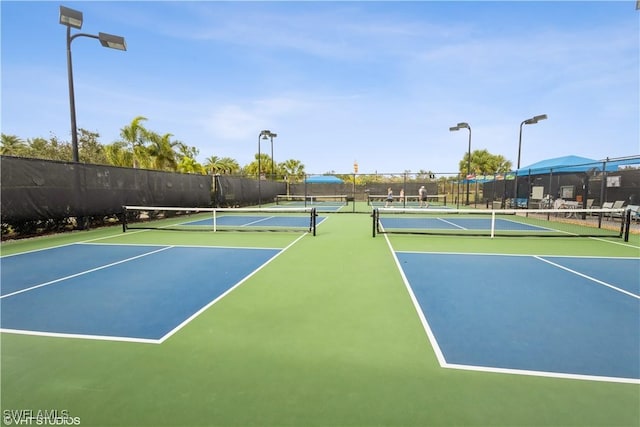 view of sport court with fence