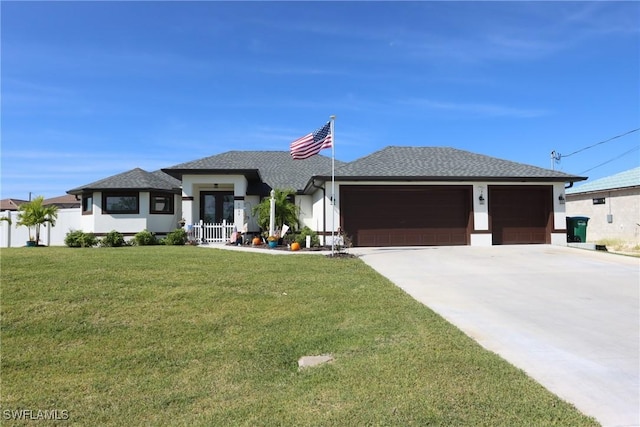 prairie-style house with a garage and a front yard