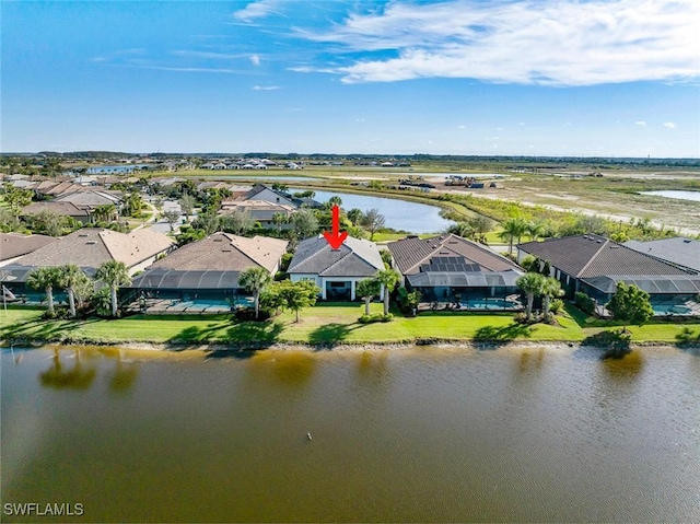 birds eye view of property featuring a residential view and a water view