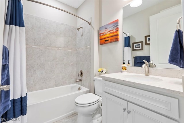 full bathroom featuring shower / bath combo, vanity, and toilet