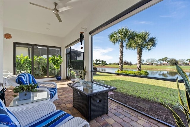 sunroom with a ceiling fan