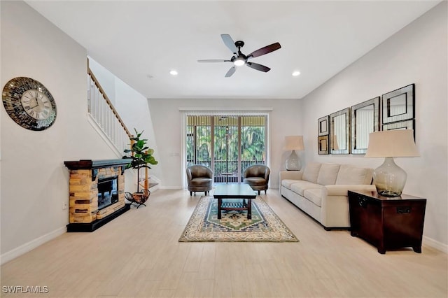 4350 Lazio Way Unit 1102, Fort Myers, FL 33901 - living area with ceiling fan, recessed lighting, wood finished floors, stairway, and a stone fireplace