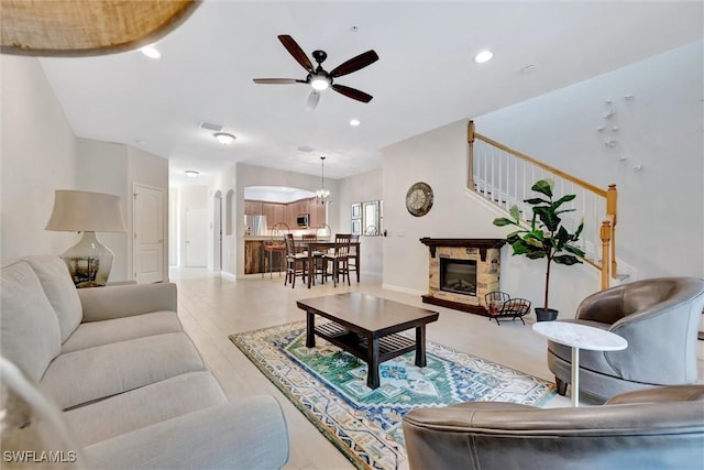 4350 Lazio Way Unit 1102, Fort Myers, FL 33901 - living room featuring a ceiling fan, recessed lighting, arched walkways, and a chandelier