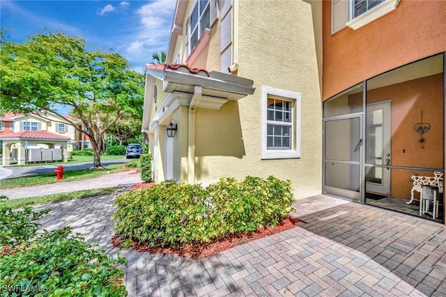 4350 Lazio Way Unit 1102, Fort Myers, FL 33901 - doorway to property featuring stucco siding