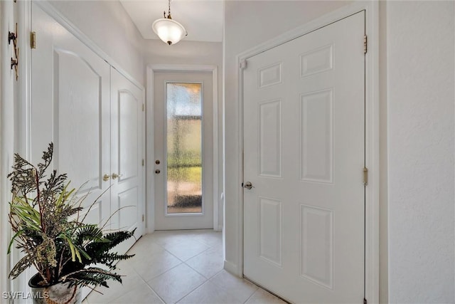 entryway featuring light tile patterned floors
