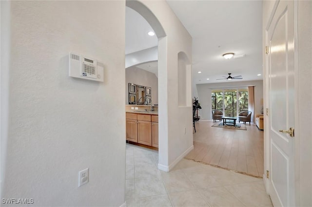4350 Lazio Way Unit 1102, Fort Myers, FL 33901 - hall with arched walkways, light tile patterned floors, and recessed lighting