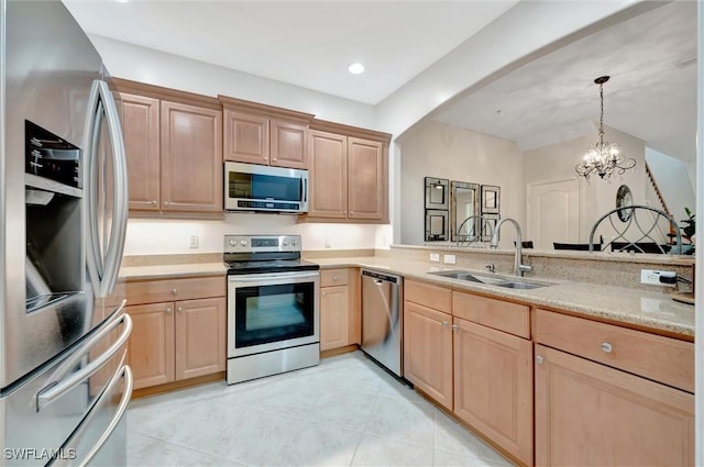4350 Lazio Way Unit 1102, Fort Myers, FL 33901 - kitchen featuring stainless steel appliances, light brown cabinetry, decorative light fixtures, light tile patterned floors, and arched walkways