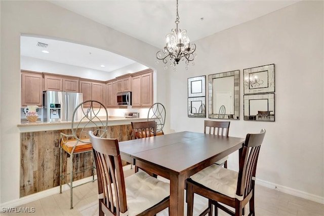 4350 Lazio Way Unit 1102, Fort Myers, FL 33901 - dining area with arched walkways, a chandelier, and recessed lighting