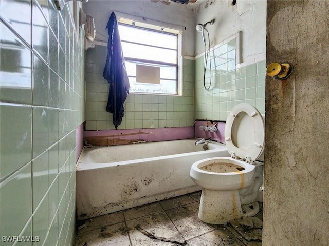 bathroom featuring tile walls and toilet