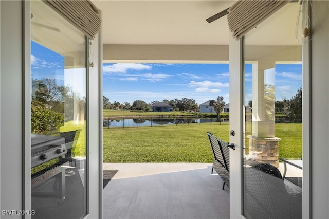 doorway to outside featuring a water view