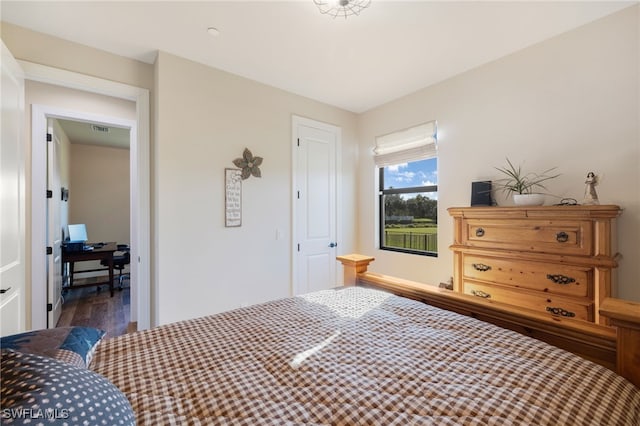 bedroom with wood-type flooring