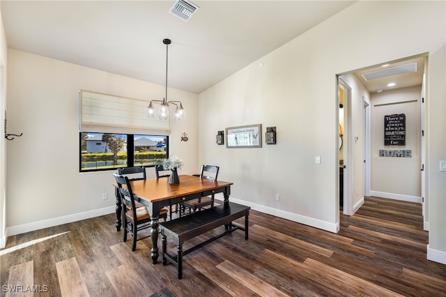 dining area with a chandelier and dark wood-type flooring