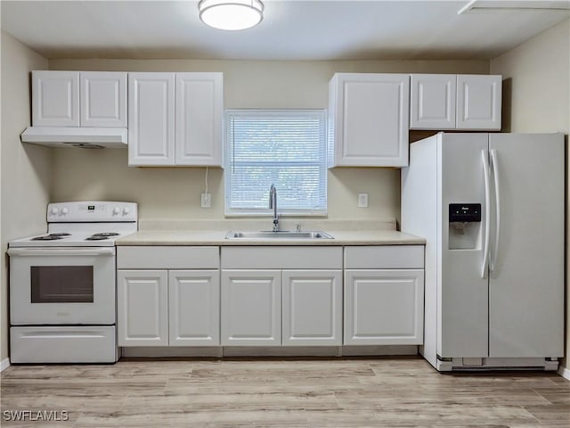 kitchen with white cabinets, light wood-type flooring, white appliances, and sink