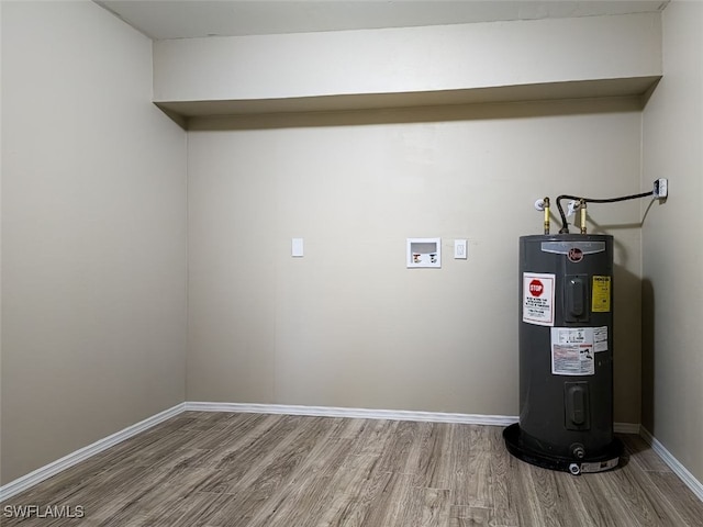 interior space with wood-type flooring, washer hookup, and water heater