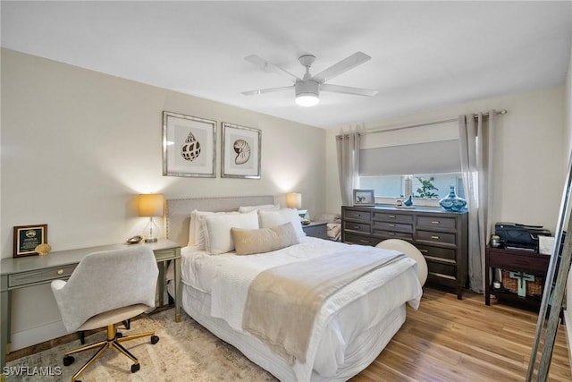 bedroom featuring ceiling fan and light hardwood / wood-style floors