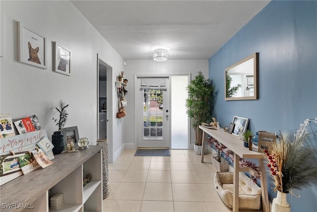 entryway with light tile patterned floors