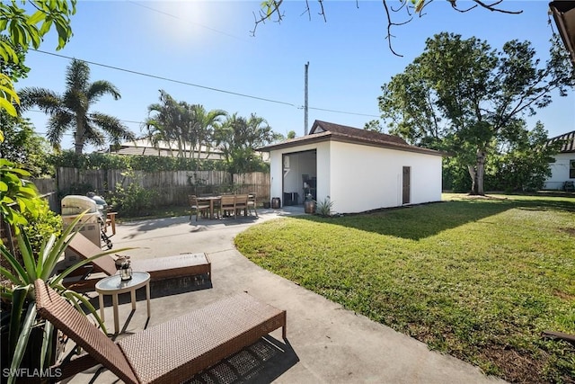 view of yard with a patio area and an outdoor structure