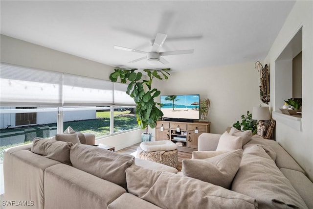 living room with ceiling fan and hardwood / wood-style flooring