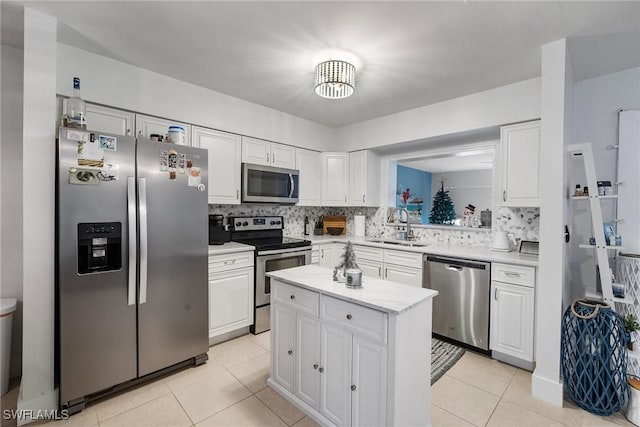 kitchen featuring white cabinets, sink, and stainless steel appliances