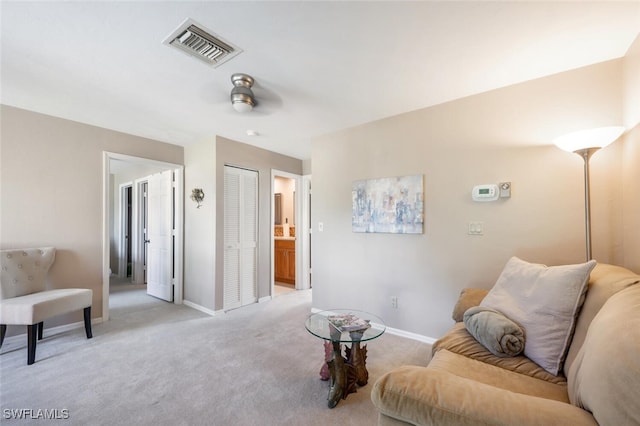 sitting room with light carpet and ceiling fan