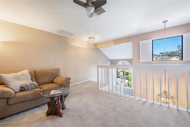 carpeted living room featuring vaulted ceiling and ceiling fan