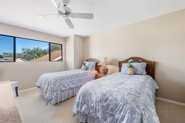 bedroom featuring ceiling fan and light colored carpet