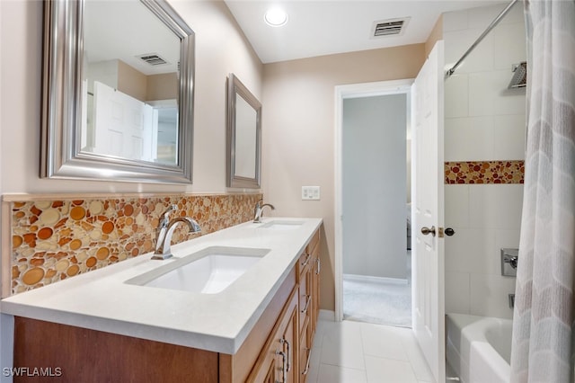 bathroom with shower / tub combo, vanity, and tile patterned floors