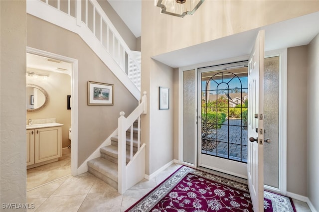 foyer entrance with light tile patterned floors