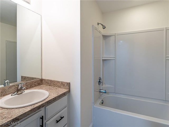 bathroom featuring vanity and tub / shower combination