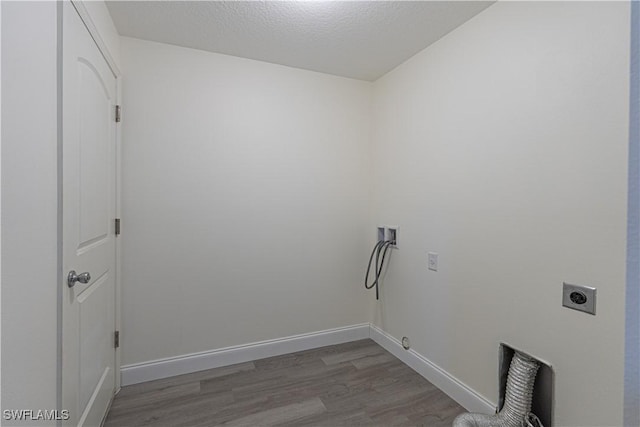 laundry area with hardwood / wood-style floors, electric dryer hookup, a textured ceiling, and hookup for a washing machine