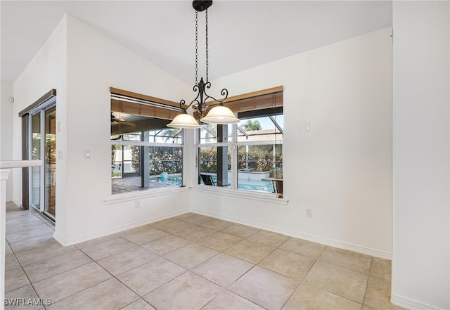 unfurnished dining area featuring lofted ceiling, a chandelier, and light tile patterned floors