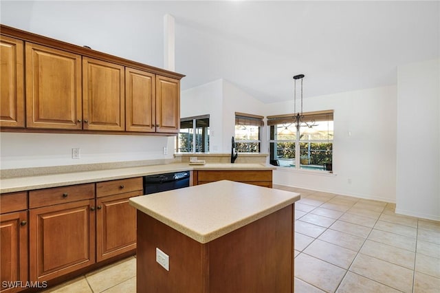 kitchen with a kitchen island, pendant lighting, light tile patterned flooring, and black dishwasher