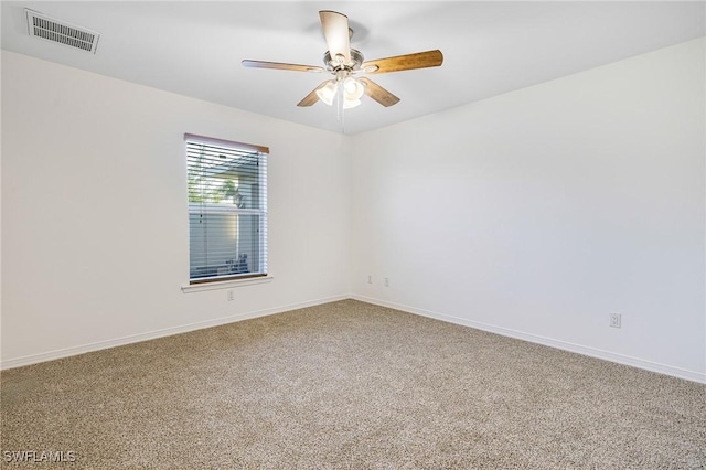 carpeted empty room with ceiling fan