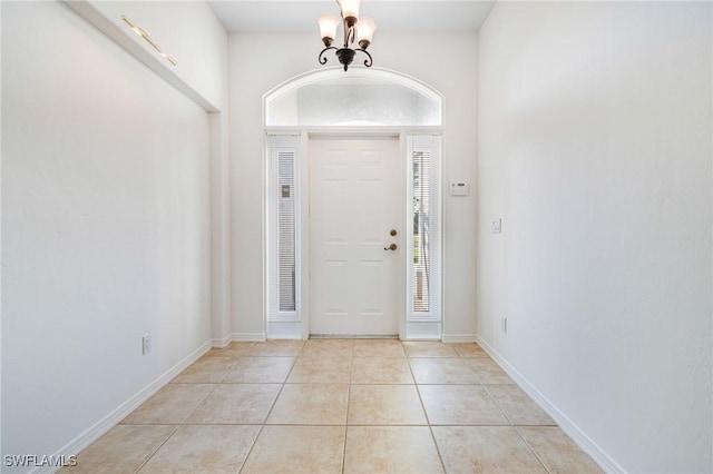 entrance foyer featuring a notable chandelier and light tile patterned floors