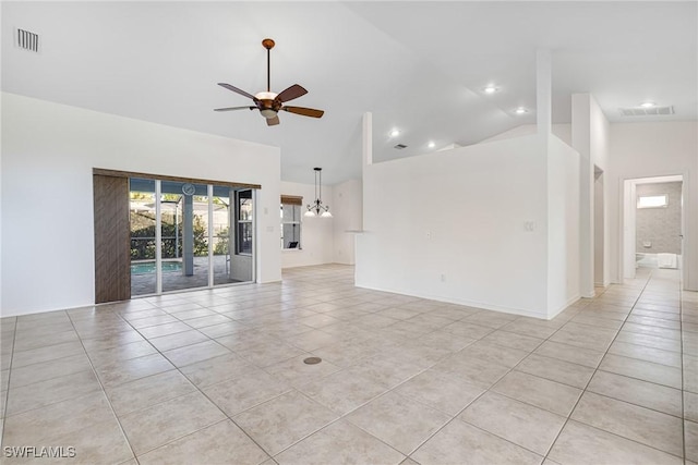 unfurnished room with ceiling fan, vaulted ceiling, and light tile patterned floors