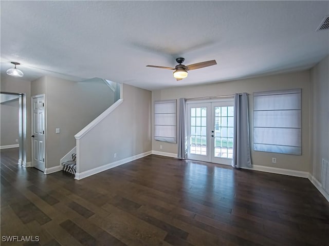 unfurnished room featuring french doors, dark hardwood / wood-style flooring, a textured ceiling, and ceiling fan