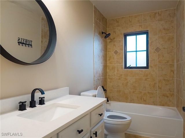 full bathroom with vanity, toilet, and tiled shower / bath combo