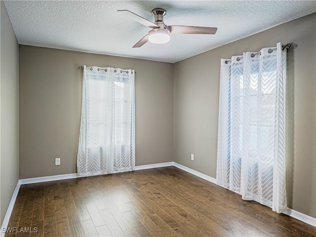 spare room with ceiling fan, a textured ceiling, and hardwood / wood-style flooring