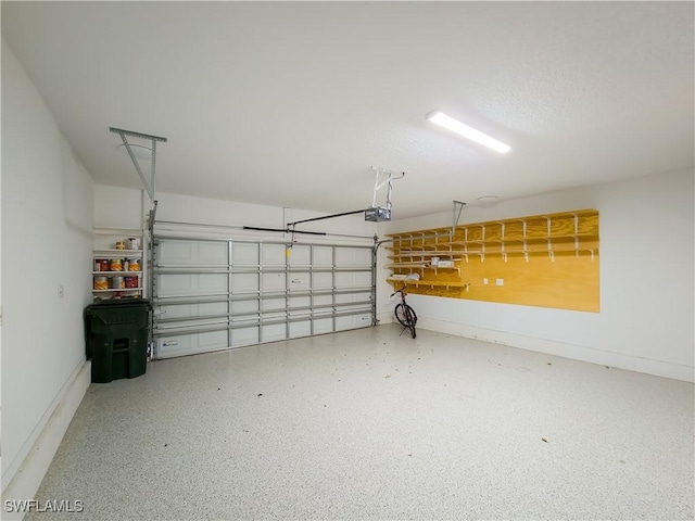 garage featuring a garage door opener