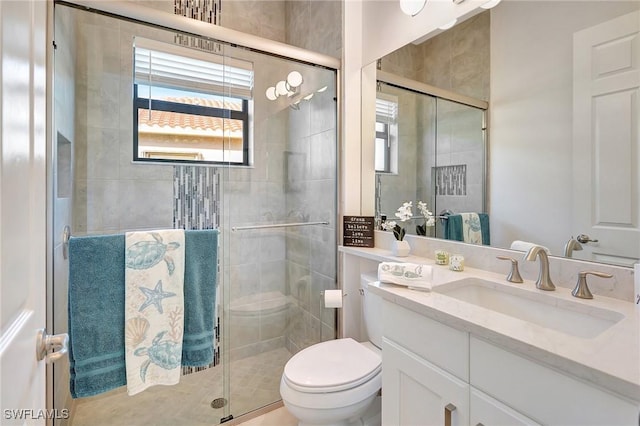 10064 Chesapeake Bay Dr, Fort Myers, FL 33913 - bathroom featuring vanity, a shower stall, and toilet