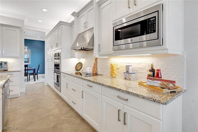10064 Chesapeake Bay Dr, Fort Myers, FL 33913 - kitchen with appliances with stainless steel finishes, under cabinet range hood, recessed lighting, light stone countertops, and ornamental molding