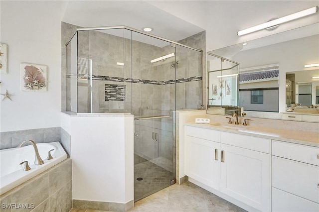 10064 Chesapeake Bay Dr, Fort Myers, FL 33913 - bathroom with a stall shower, vanity, a garden tub, and tile patterned flooring