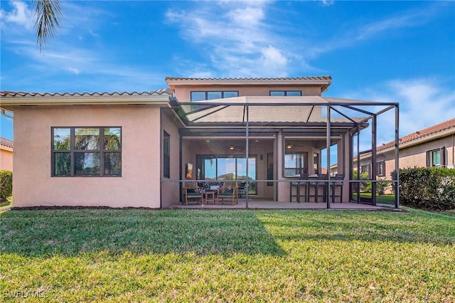 10064 Chesapeake Bay Dr, Fort Myers, FL 33913 - rear view of property featuring stucco siding, a lawn, a patio, glass enclosure, and a tile roof