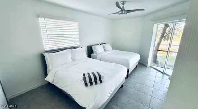 tiled bedroom featuring ceiling fan and access to outside