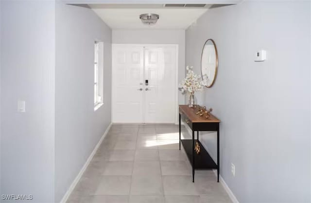 hallway with light tile patterned flooring