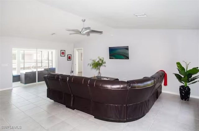 tiled living room featuring ceiling fan