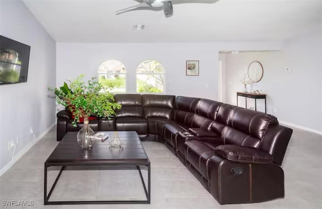 living room featuring light tile patterned floors and ceiling fan